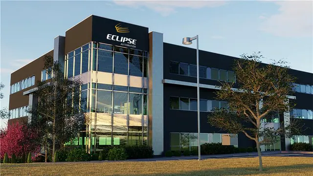Exterior view of Eclipse Automation's Cambridge, Ontario headquarters building, a dark-paneled office and manufacturing facility with the Eclipse Automation logo on the corner tower.